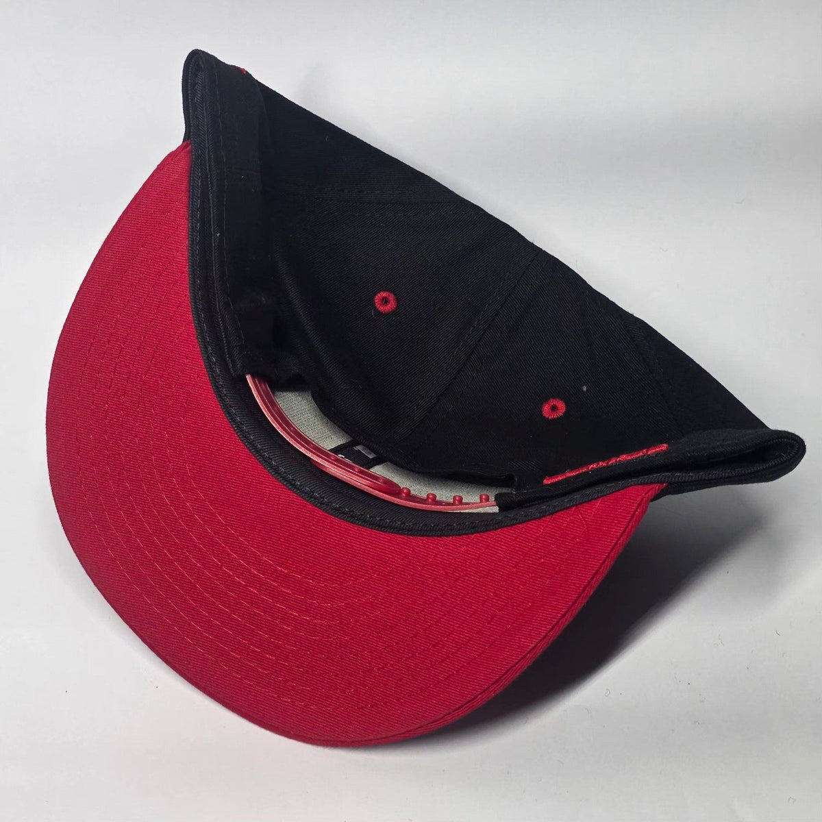 New Era black and red snapback cap with Black Widow patch and Marvel logo.