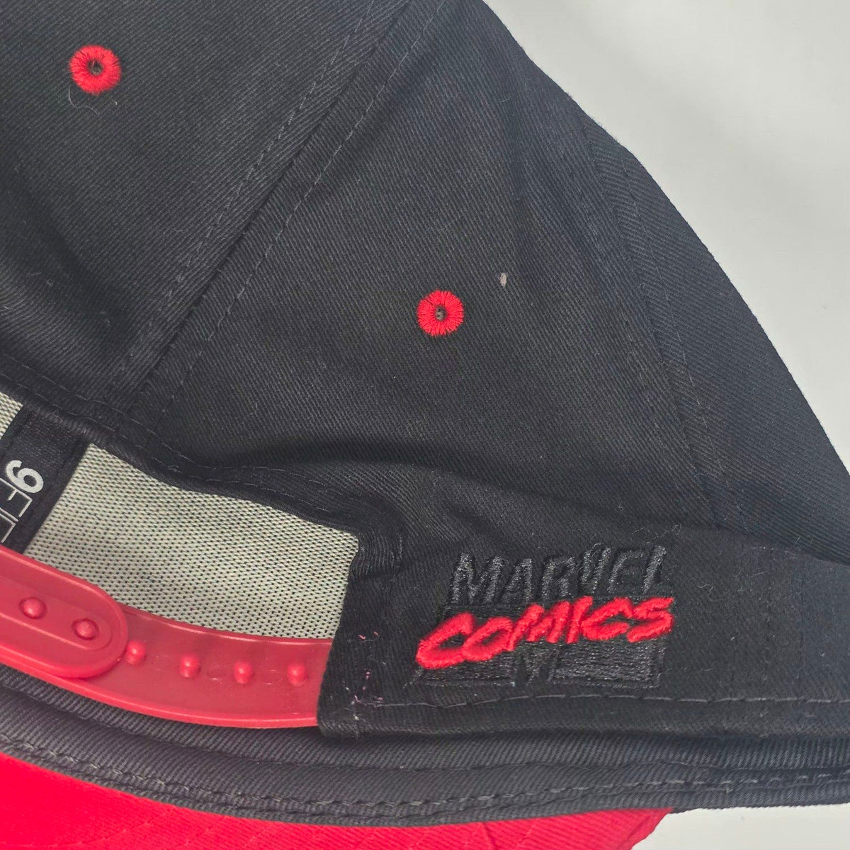 New Era black and red snapback cap with Black Widow patch and Marvel logo.