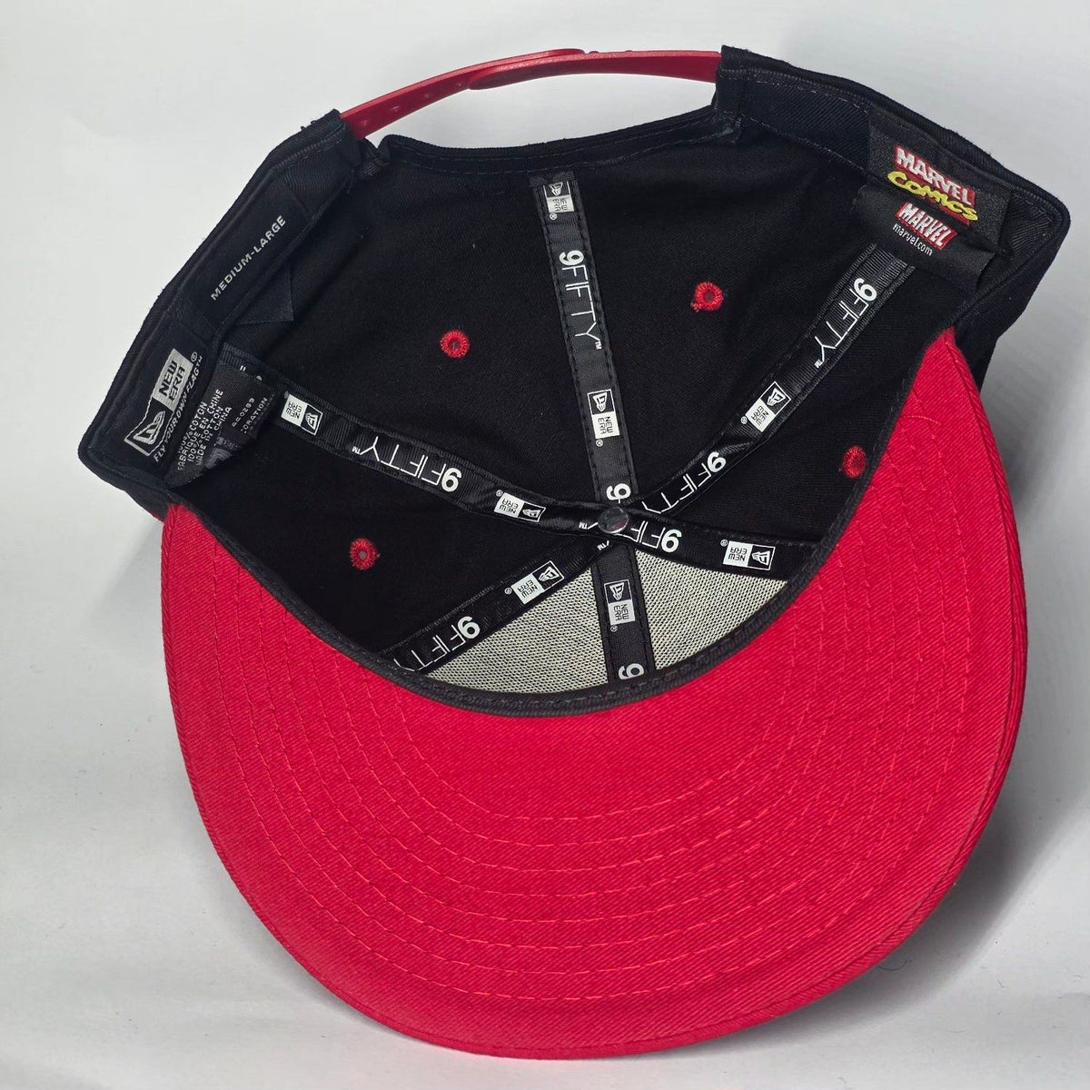 New Era black and red snapback cap with Black Widow patch and Marvel logo.